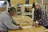 WindowDressers volunteers build draft-blocking inserts